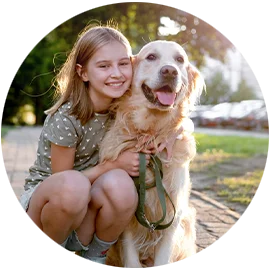 Daughter cuddling with her dog