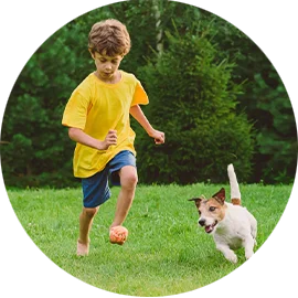 kid running with his dog